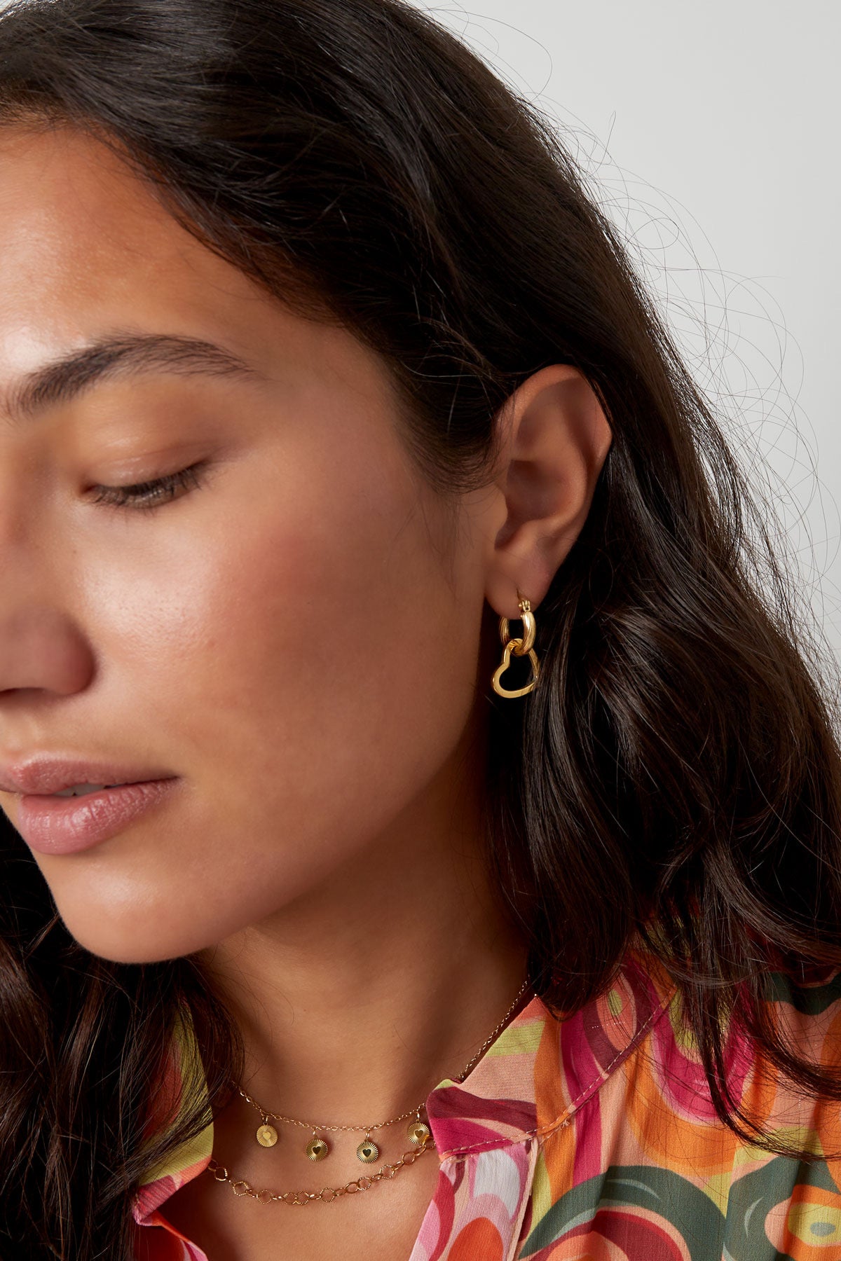 Oorbellen Twisted love - Goud